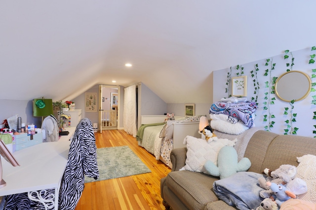 bedroom featuring lofted ceiling, recessed lighting, and wood finished floors