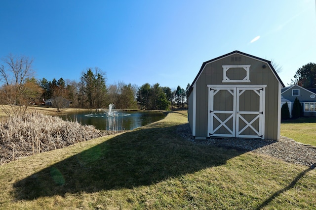 view of shed with a water view