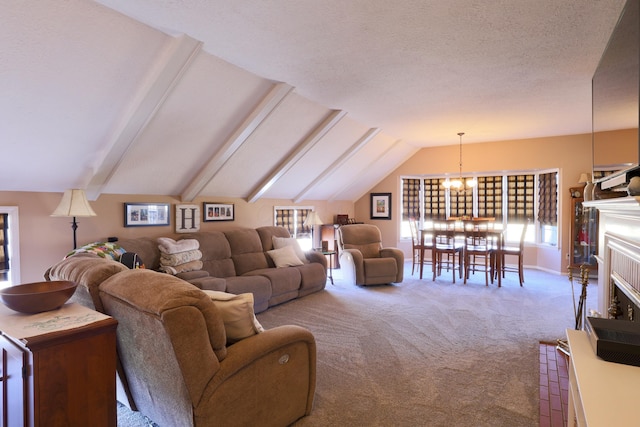 living area with a healthy amount of sunlight, a fireplace, vaulted ceiling with beams, and carpet