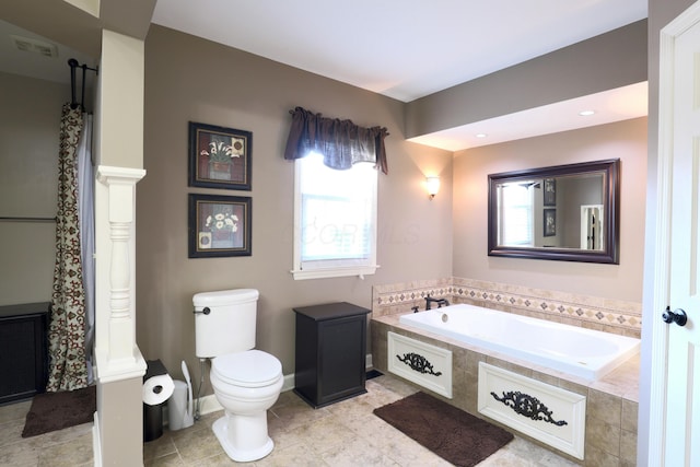 bathroom with tile patterned flooring, visible vents, baseboards, toilet, and a garden tub