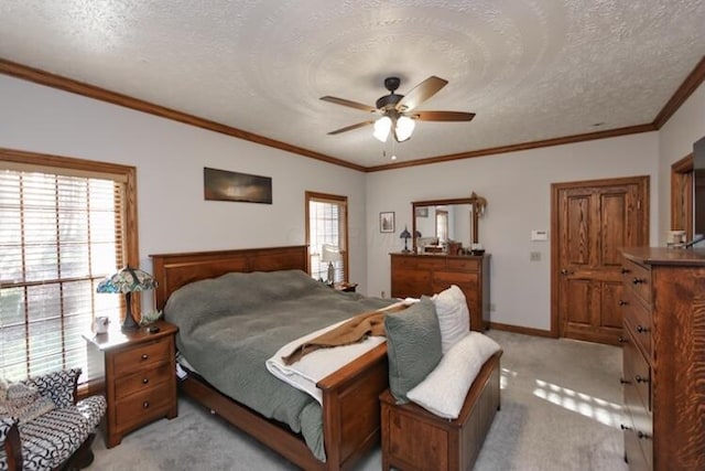 bedroom with a ceiling fan, baseboards, ornamental molding, a textured ceiling, and light carpet