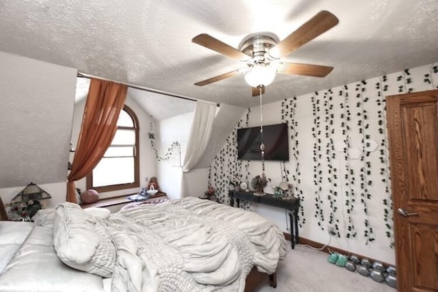 bedroom with lofted ceiling, carpet flooring, and a textured ceiling