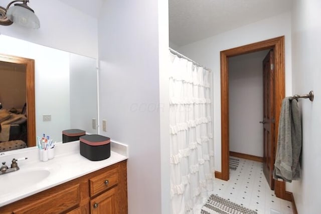 bathroom featuring tile patterned floors, vanity, ensuite bathroom, and a shower with curtain