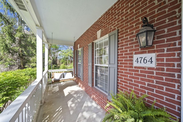 balcony featuring covered porch