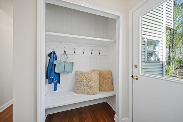 mudroom with wood finished floors and baseboards