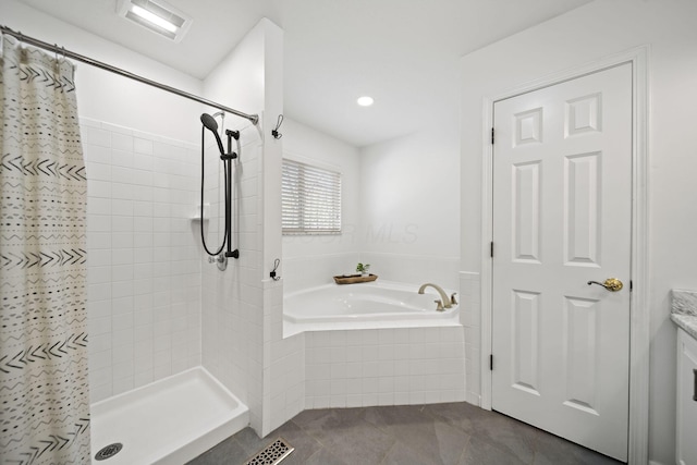 bathroom featuring visible vents, a shower stall, a garden tub, and tile patterned flooring