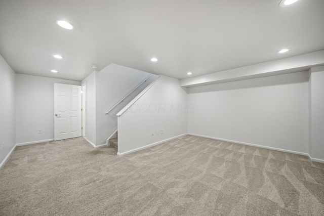 finished below grade area with carpet, recessed lighting, and baseboards