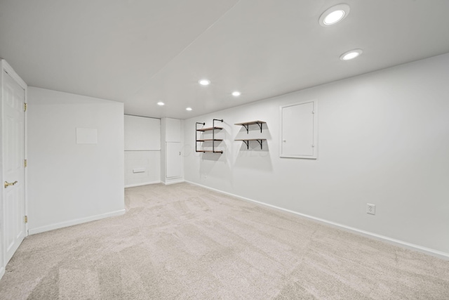 finished below grade area featuring baseboards, recessed lighting, and carpet floors