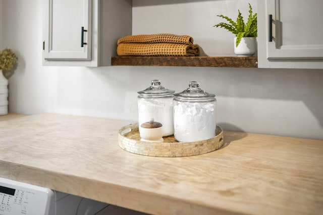 room details featuring light countertops and white cabinets