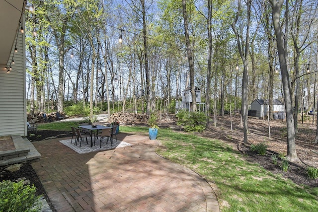 view of patio featuring outdoor dining area