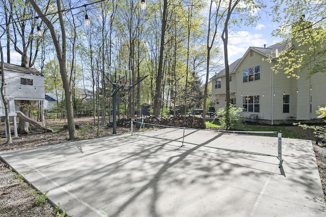 view of patio / terrace featuring a tennis court