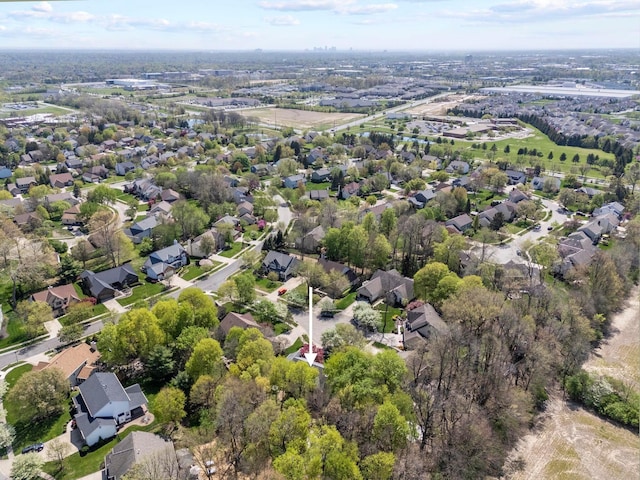 birds eye view of property with a residential view
