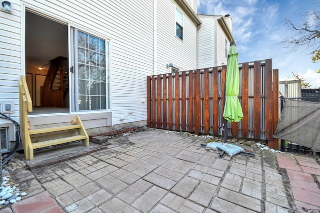 view of patio featuring fence