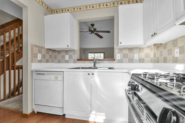 kitchen with a ceiling fan, a sink, gas stove, light countertops, and dishwasher