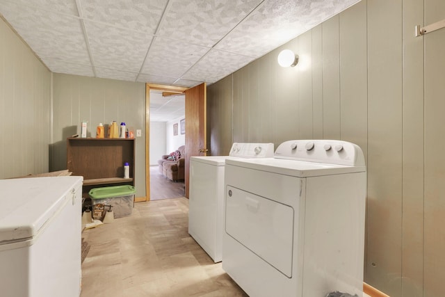 washroom with washing machine and clothes dryer