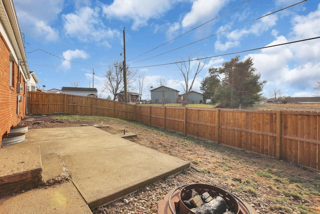 view of yard featuring a patio area and a fenced backyard