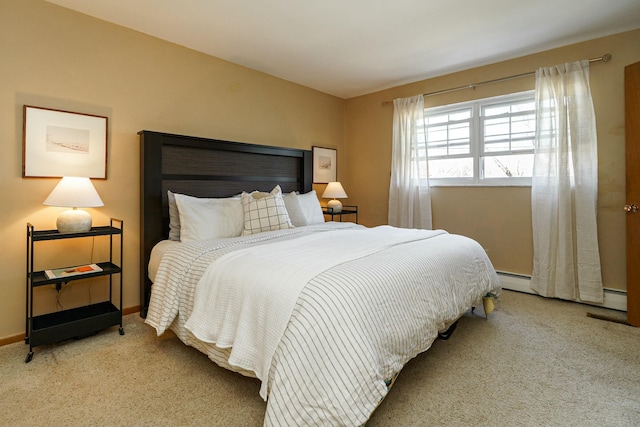 carpeted bedroom with baseboards