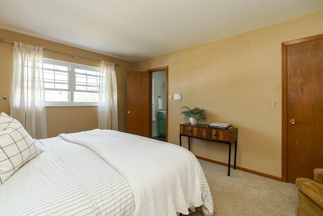 carpeted bedroom with baseboards