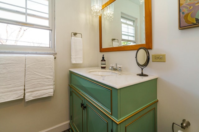 bathroom with baseboards and vanity