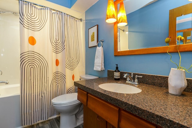 bathroom with vanity, shower / bath combination with curtain, toilet, and wood finished floors