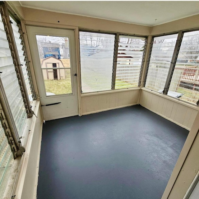 unfurnished sunroom with plenty of natural light