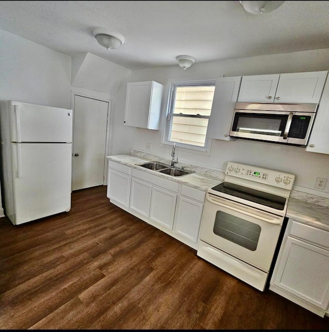 kitchen featuring a sink, white appliances, white cabinets, light countertops, and dark wood-style flooring