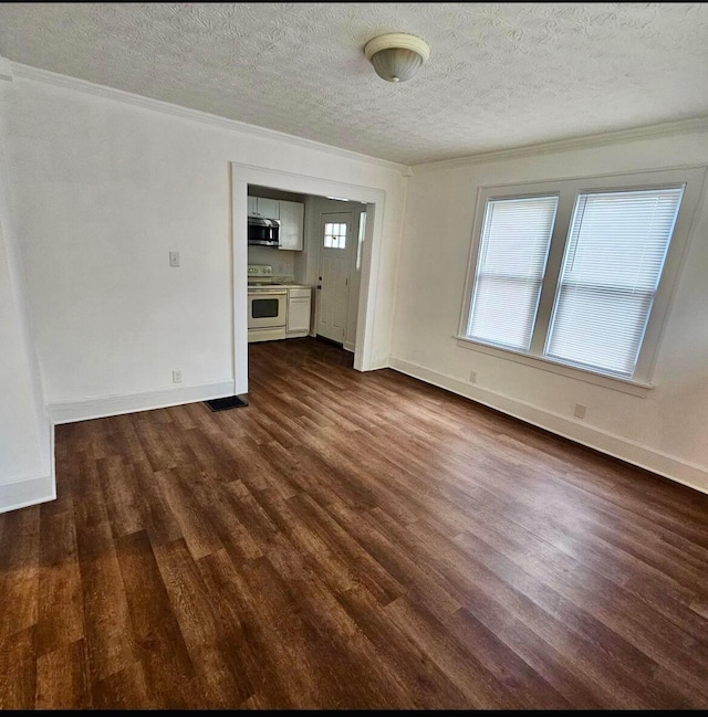 unfurnished room with baseboards, a textured ceiling, and dark wood-style flooring