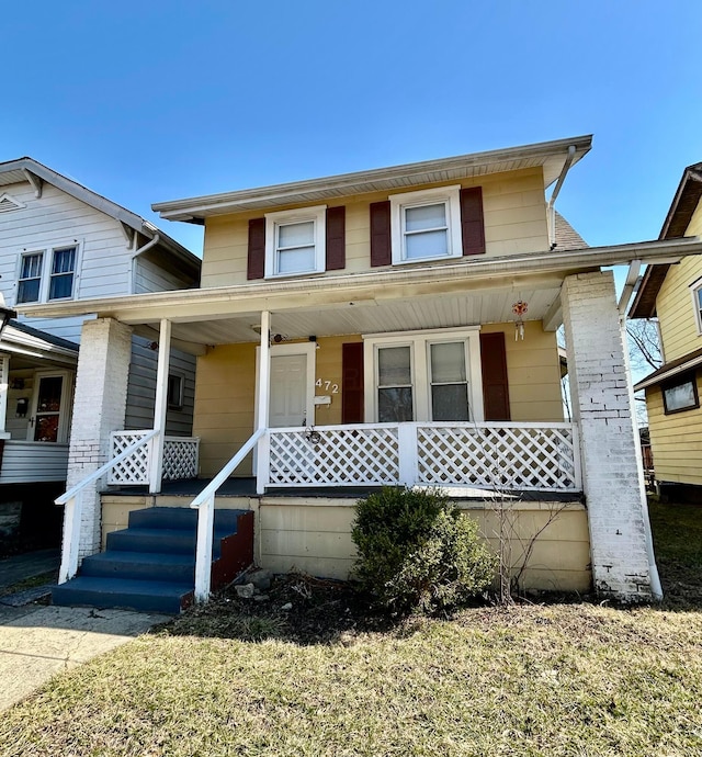 view of front of property featuring covered porch