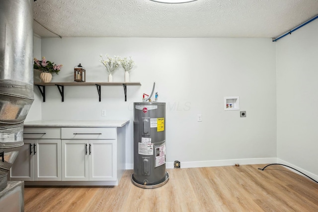 laundry room with electric dryer hookup, washer hookup, water heater, and light wood finished floors