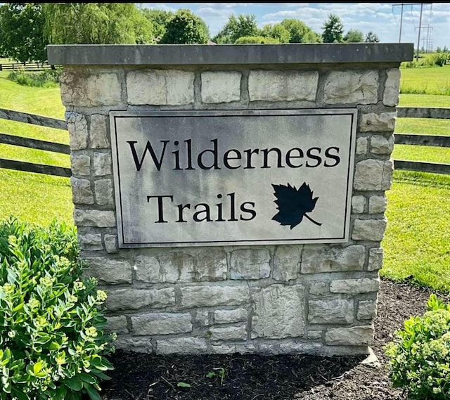 community sign with fence