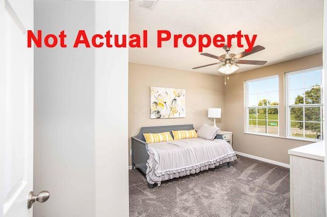 bedroom with baseboards and carpet