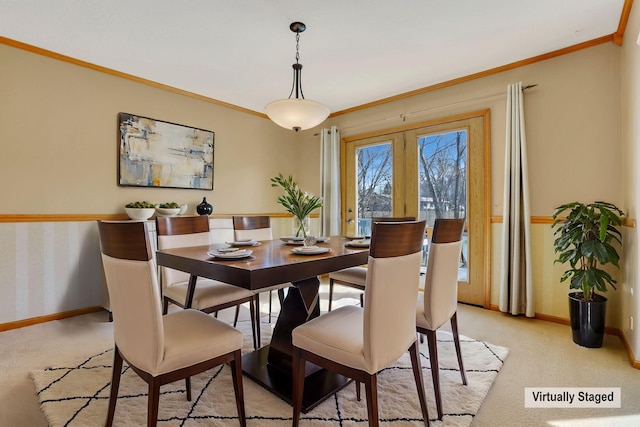 dining area with light carpet, french doors, baseboards, and ornamental molding