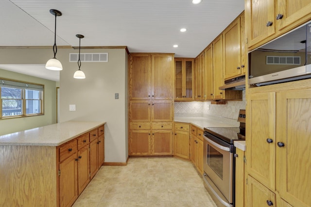 kitchen featuring visible vents, under cabinet range hood, backsplash, appliances with stainless steel finishes, and a peninsula