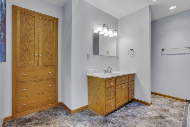 bathroom featuring vanity and baseboards