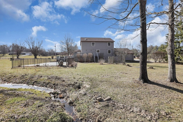 view of yard with stairway and fence