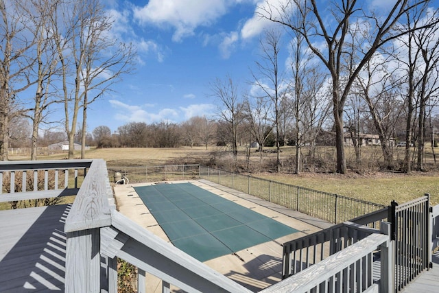 view of swimming pool with a fenced in pool, a yard, and fence