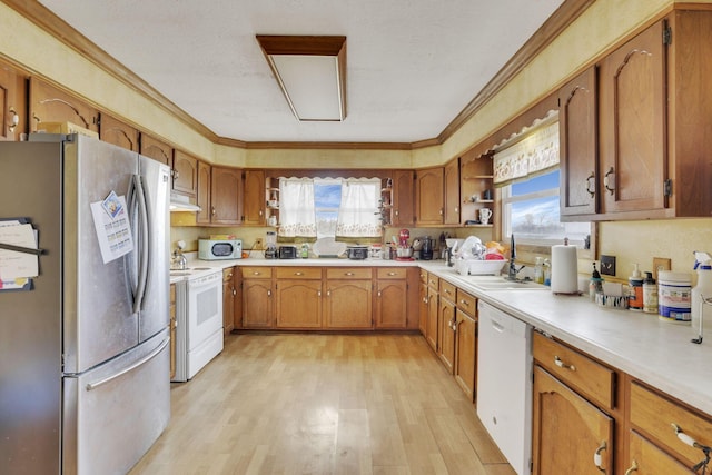 kitchen with brown cabinetry, white appliances, and open shelves