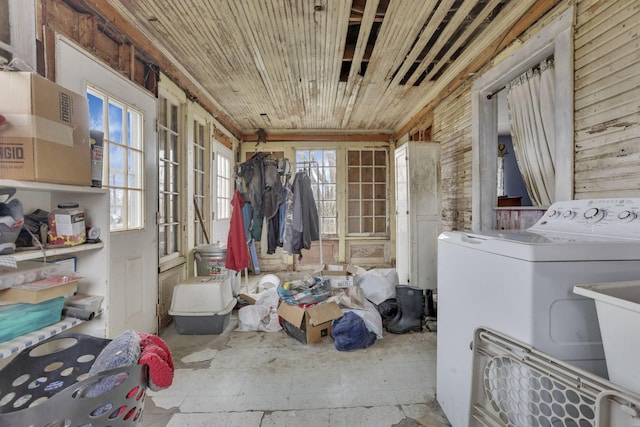 washroom with wooden ceiling, washer / clothes dryer, and a healthy amount of sunlight