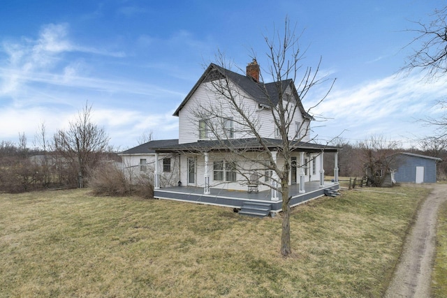 exterior space with a yard and a chimney