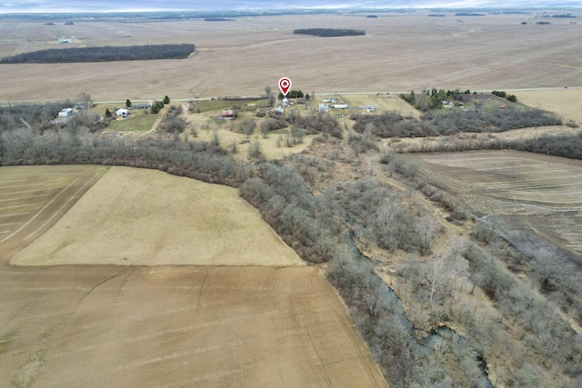 birds eye view of property with a rural view