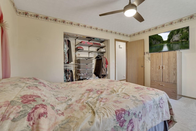 bedroom featuring a closet, baseboards, a ceiling fan, and carpet floors