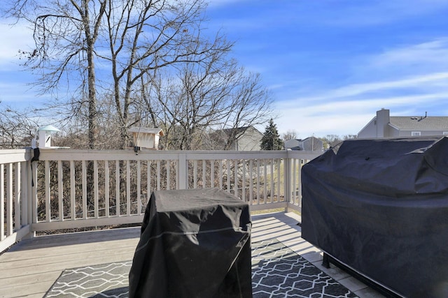 wooden terrace featuring area for grilling