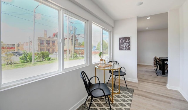 sitting room featuring recessed lighting, baseboards, and light wood finished floors