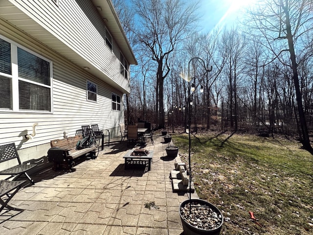 view of patio featuring a fire pit