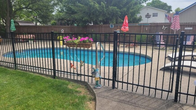 view of pool featuring a fenced in pool, a patio, and fence