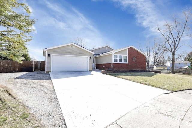 ranch-style home with fence, concrete driveway, a front yard, a garage, and brick siding