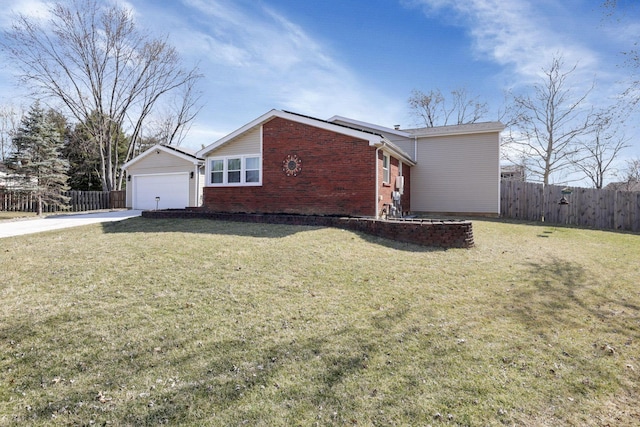 view of side of property featuring a garage, fence, brick siding, and a yard