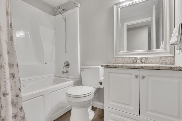 bathroom with vanity, toilet, shower / bath combo with shower curtain, and wood finished floors