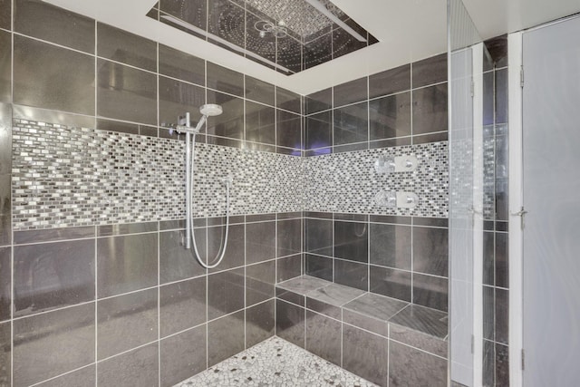 bathroom with tiled shower