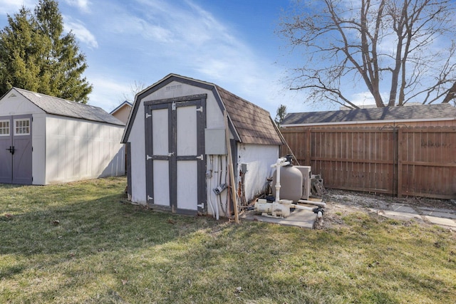 view of shed with fence